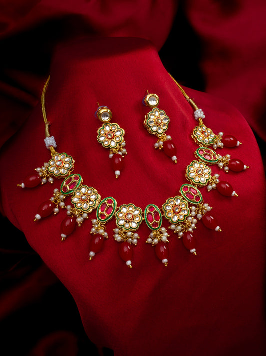 Aadita Gold Plated Kundan Floral Necklace Set with Red Beads
