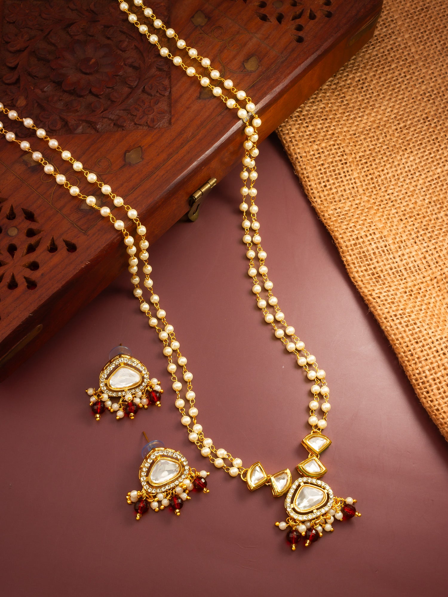 Aadita Gold Plated Kundan and Pearl Long Necklace Set with Red Accents