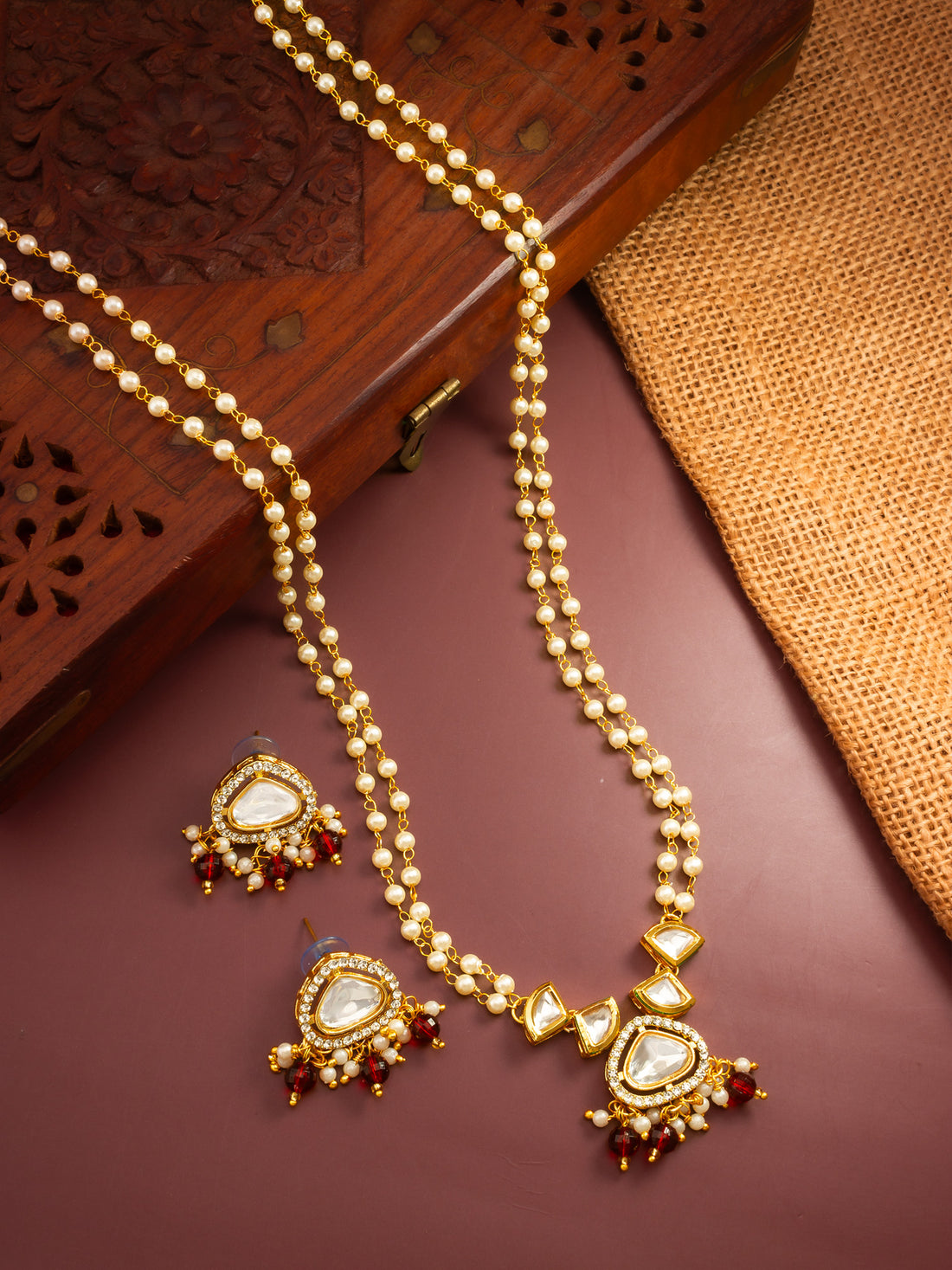 Aadita Gold Plated Kundan and Pearl Long Necklace Set with Red Accents