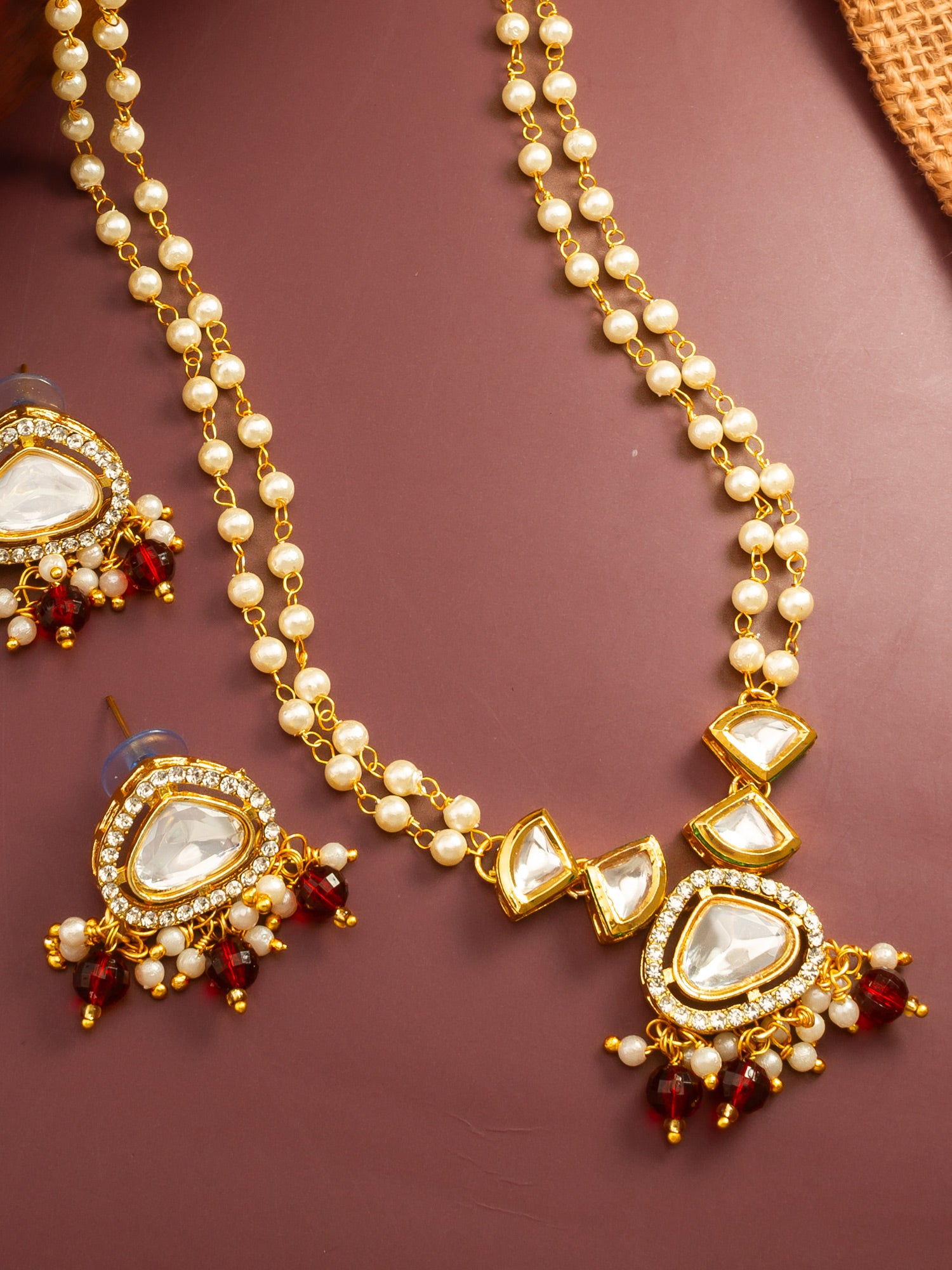 Aadita Gold Plated Kundan and Pearl Long Necklace Set with Red Accents
