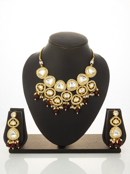 Aadita Gold Plated Kundan Studded Choker Necklace Set with Red Bead Drops
