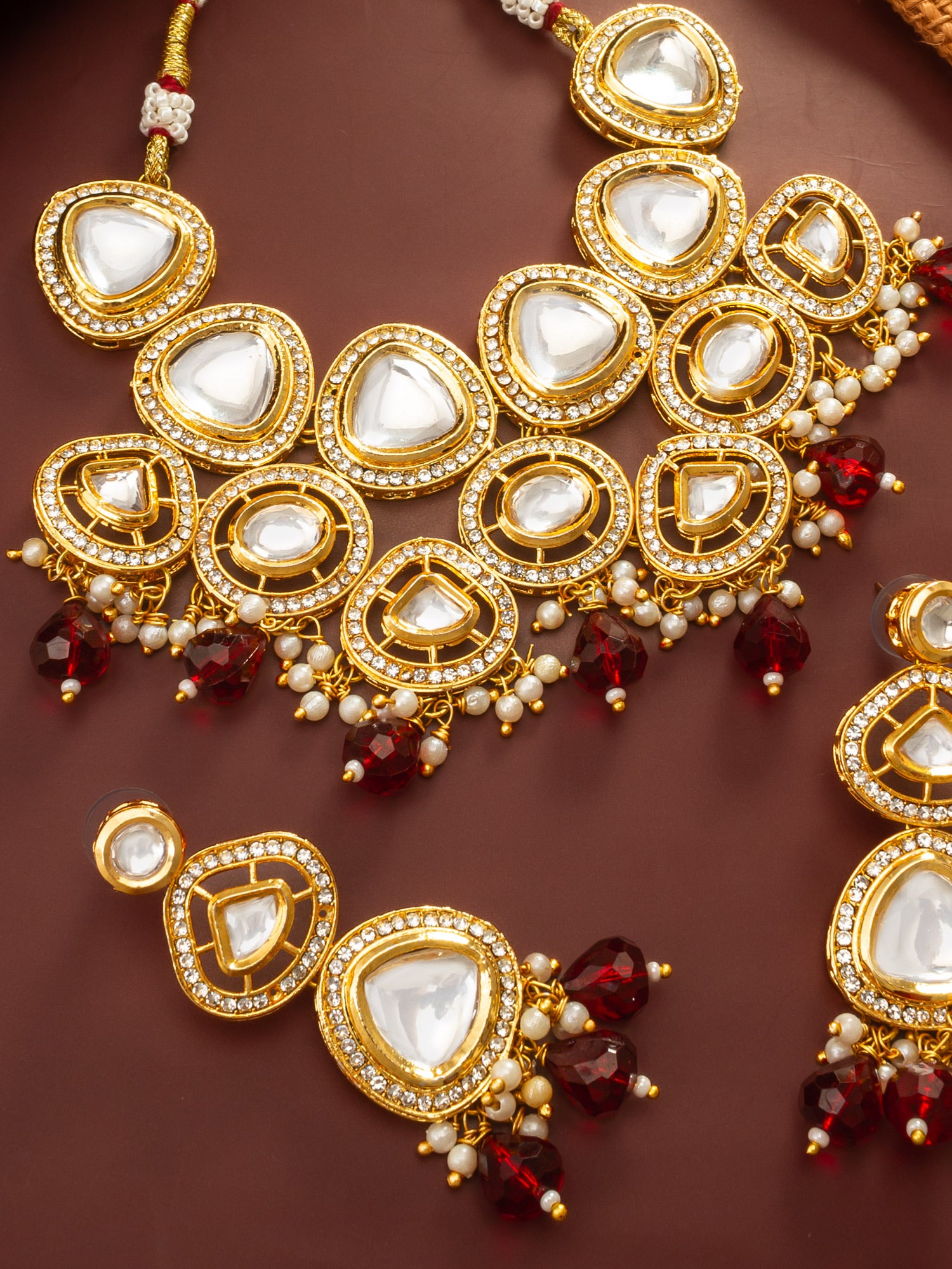Aadita Gold Plated Kundan Studded Choker Necklace Set with Red Bead Drops