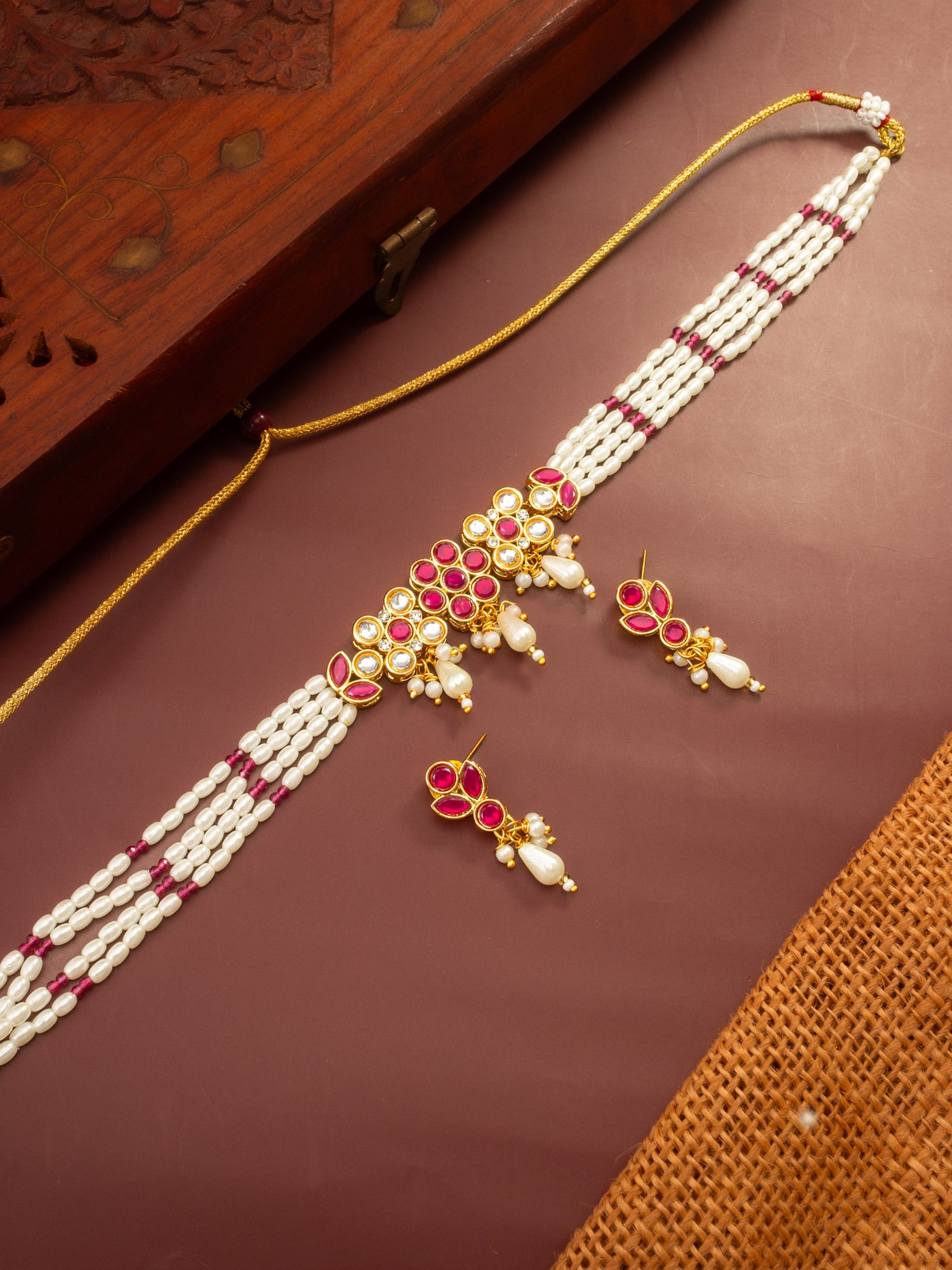 Aadita Gold Plated Multi-Strand Pearl Necklace with Red Stone Detail