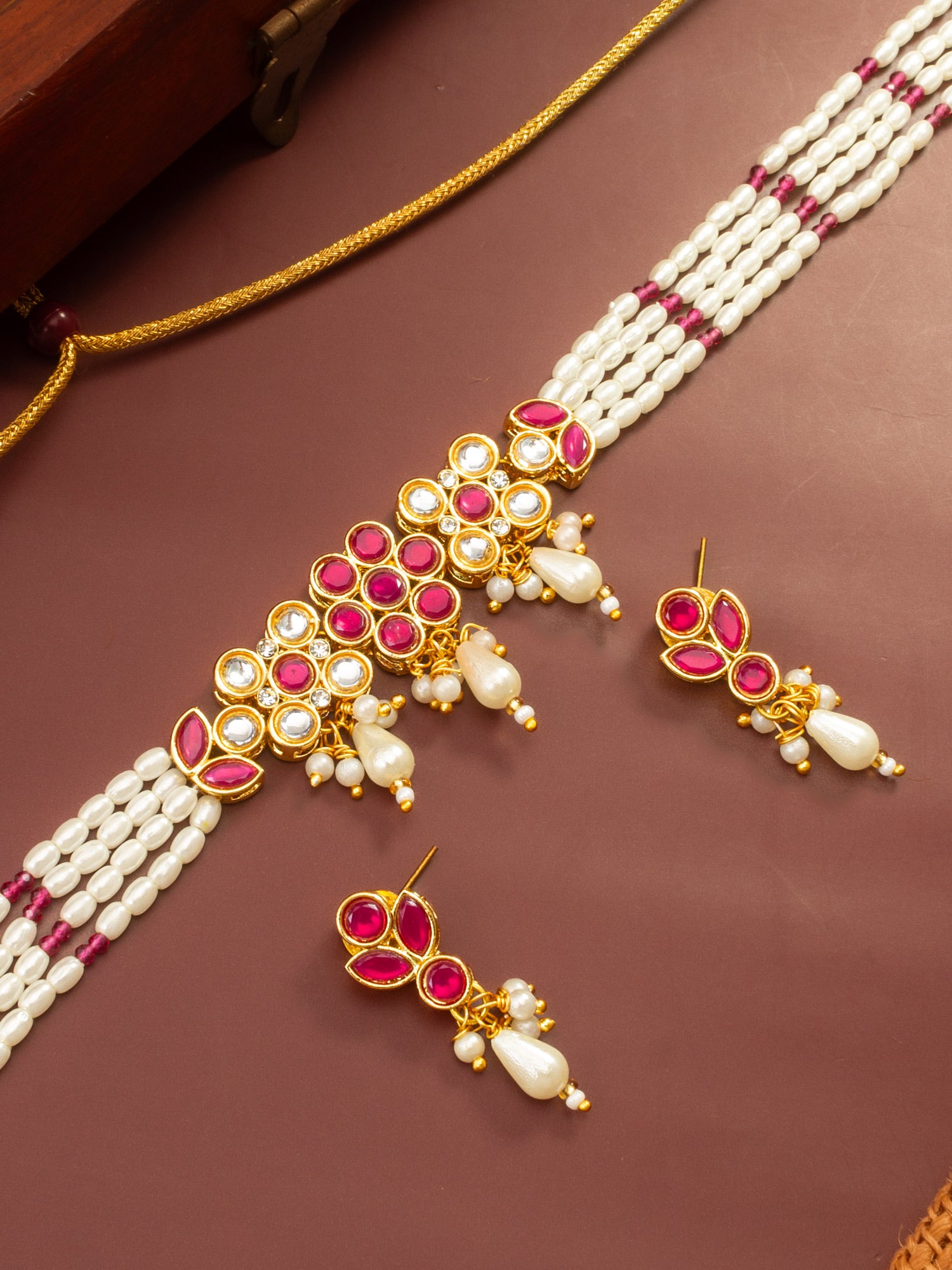 Aadita Gold Plated Multi-Strand Pearl Necklace with Red Stone Detail