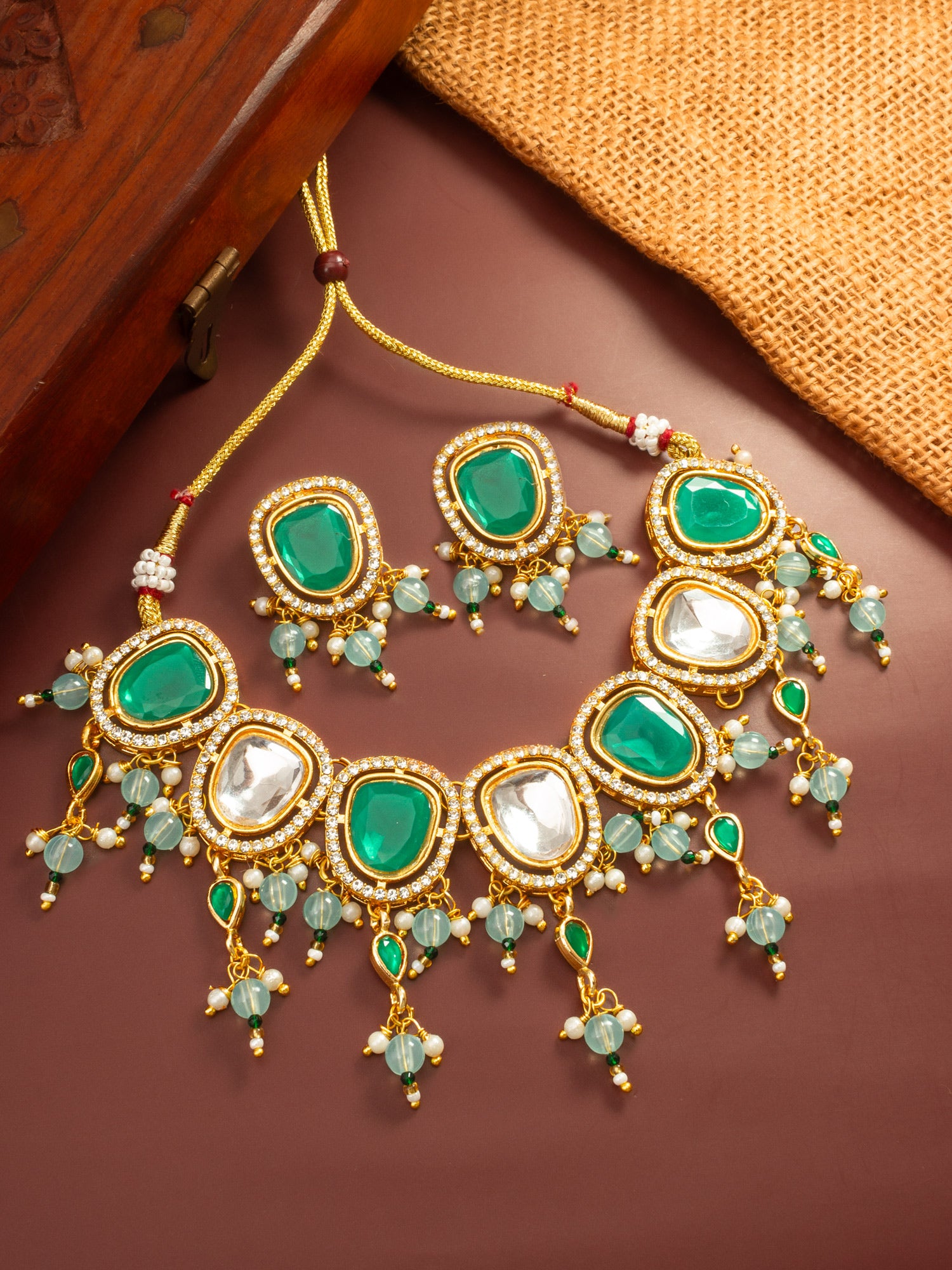 Aadita Gold Plated Green and White Kundan Statement Necklace Set