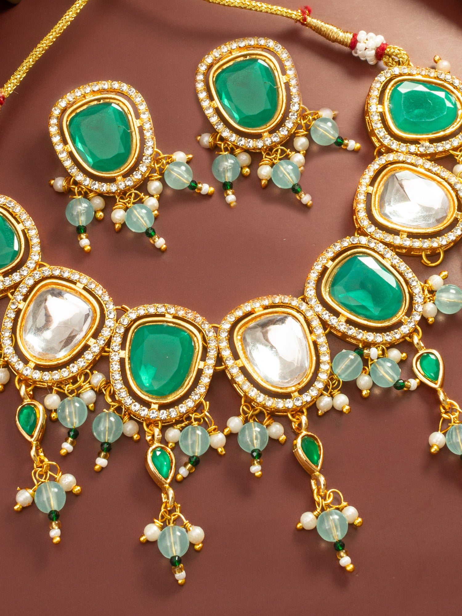 Aadita Gold Plated Green and White Kundan Statement Necklace Set