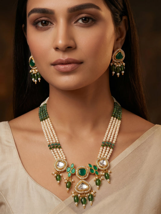 Aadita Gold Plated Long Pearl Necklace Set with Green Stone Pendant and Earrings