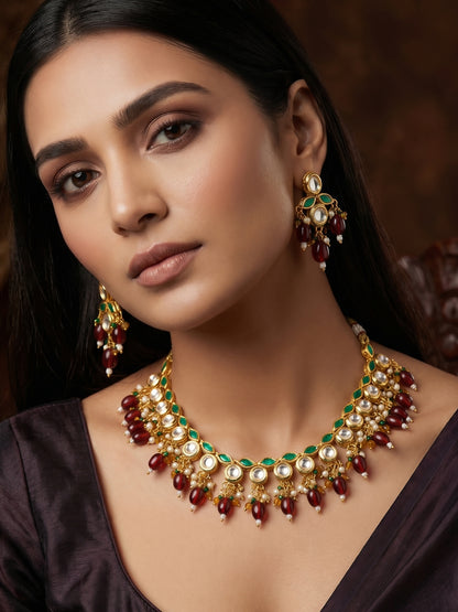 Aadita Gold Plated Kundan Necklace Set with Green Meenakari, Red Beads and Crystal Accents with Earrings