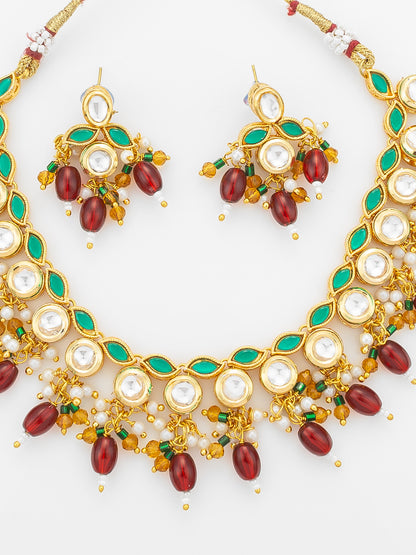 Aadita Gold Plated Kundan Necklace Set with Green Meenakari, Red Beads and Crystal Accents with Earrings
