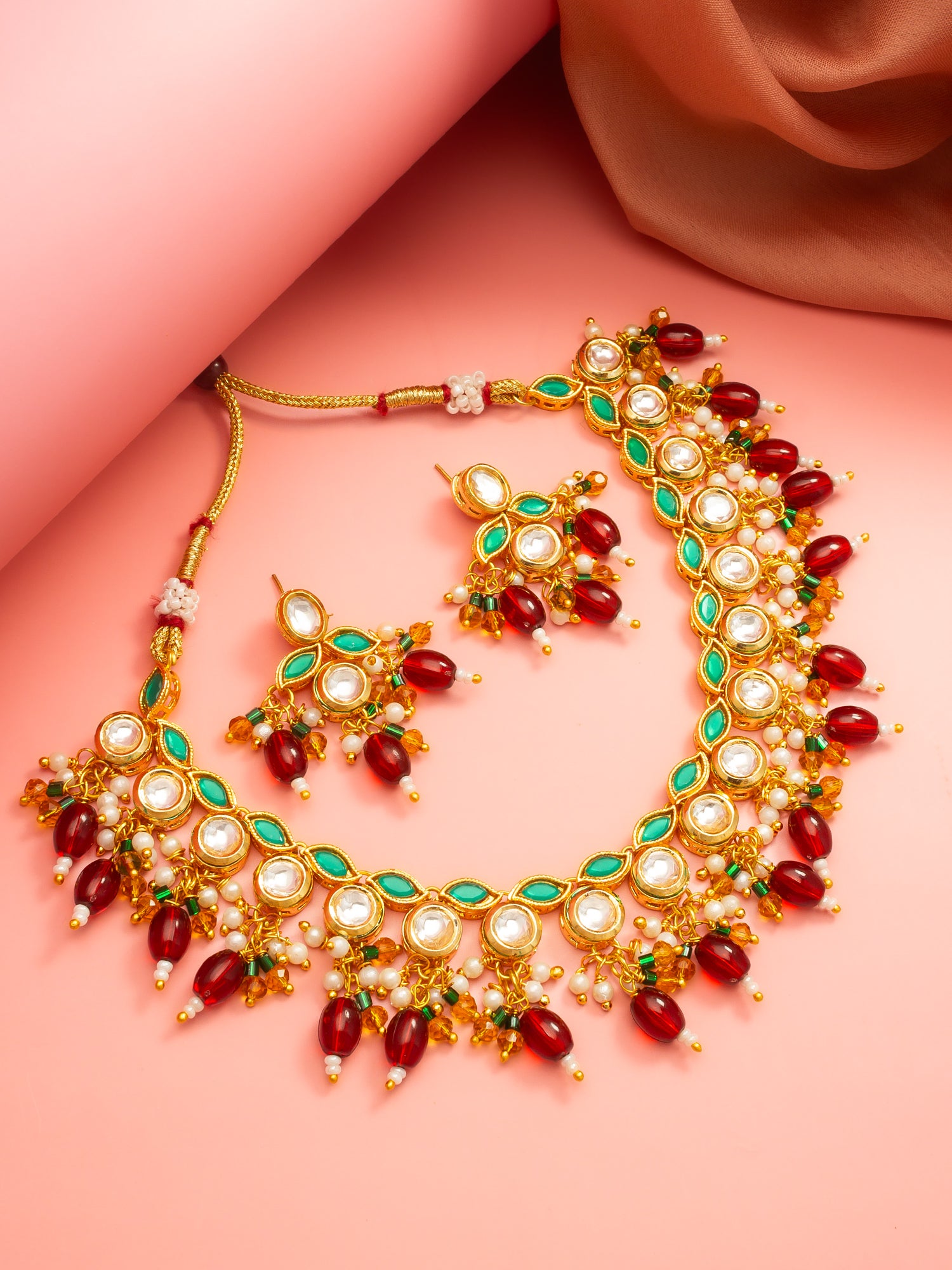 Aadita Gold Plated Kundan Necklace Set with Green Meenakari, Red Beads and Crystal Accents with Earrings
