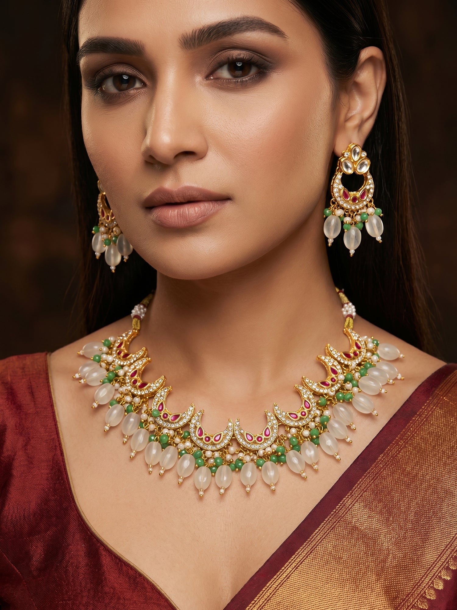 Aadita Gold Plated Kundan Necklace Set with Green Beads and White Drop with Chandbali Earrings