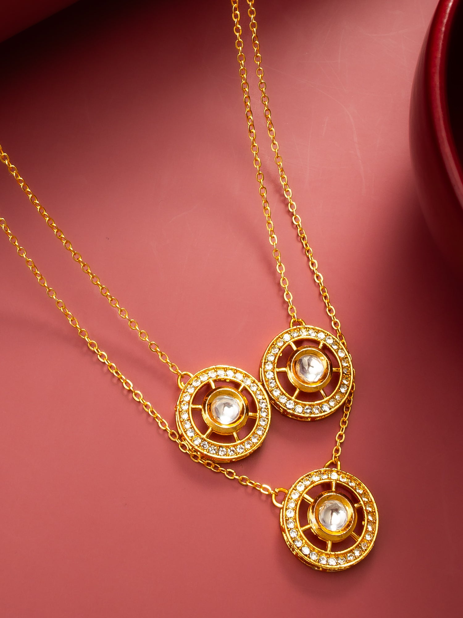 Aadita Gold-Plated Triple Kundan Layered Necklace with Crystal Embellishments