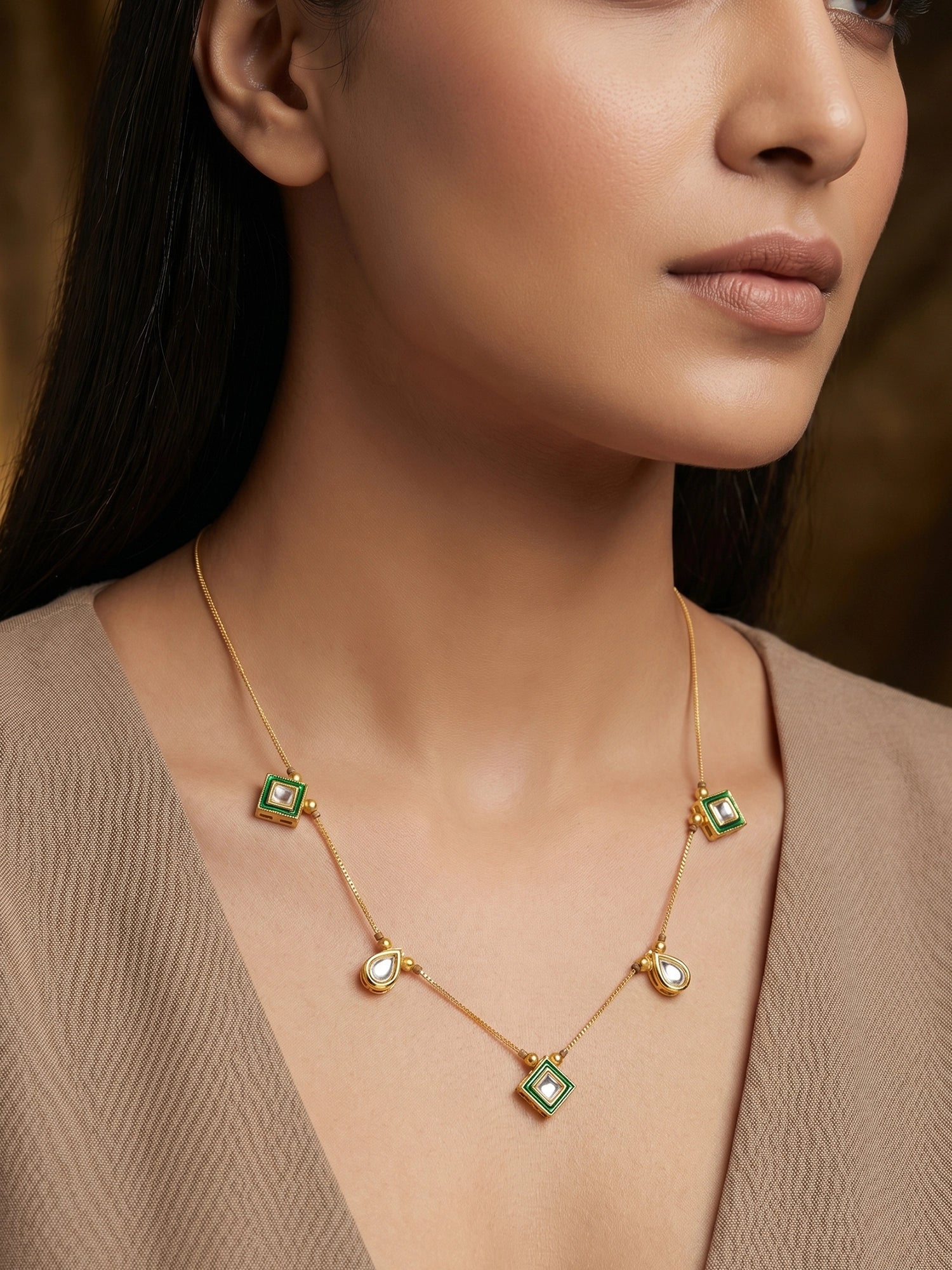 Aadita Gold Plated Kundan Necklace with Green Enamel and Multi-Shape Pendants