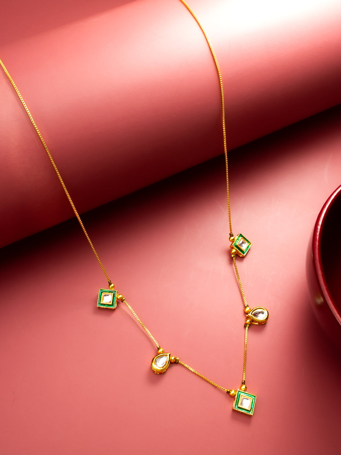Gold Plated Kundan Necklace with Green Enamel and Multi-Shape Pendants