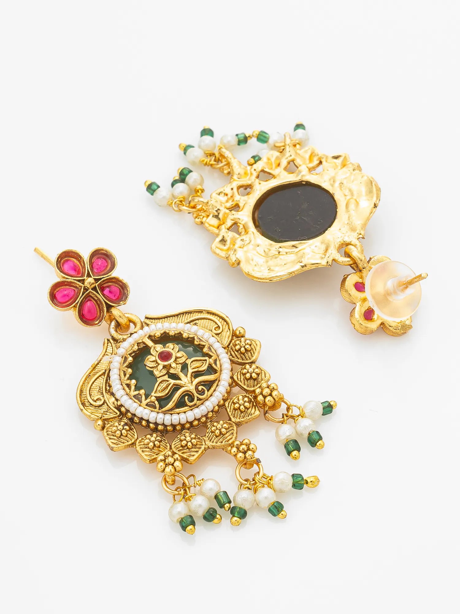 A pair of ornate gold-toned traditional Indian jhumka earrings decorated with pink, green, and white stones and beadwork, displayed on a clean white background.