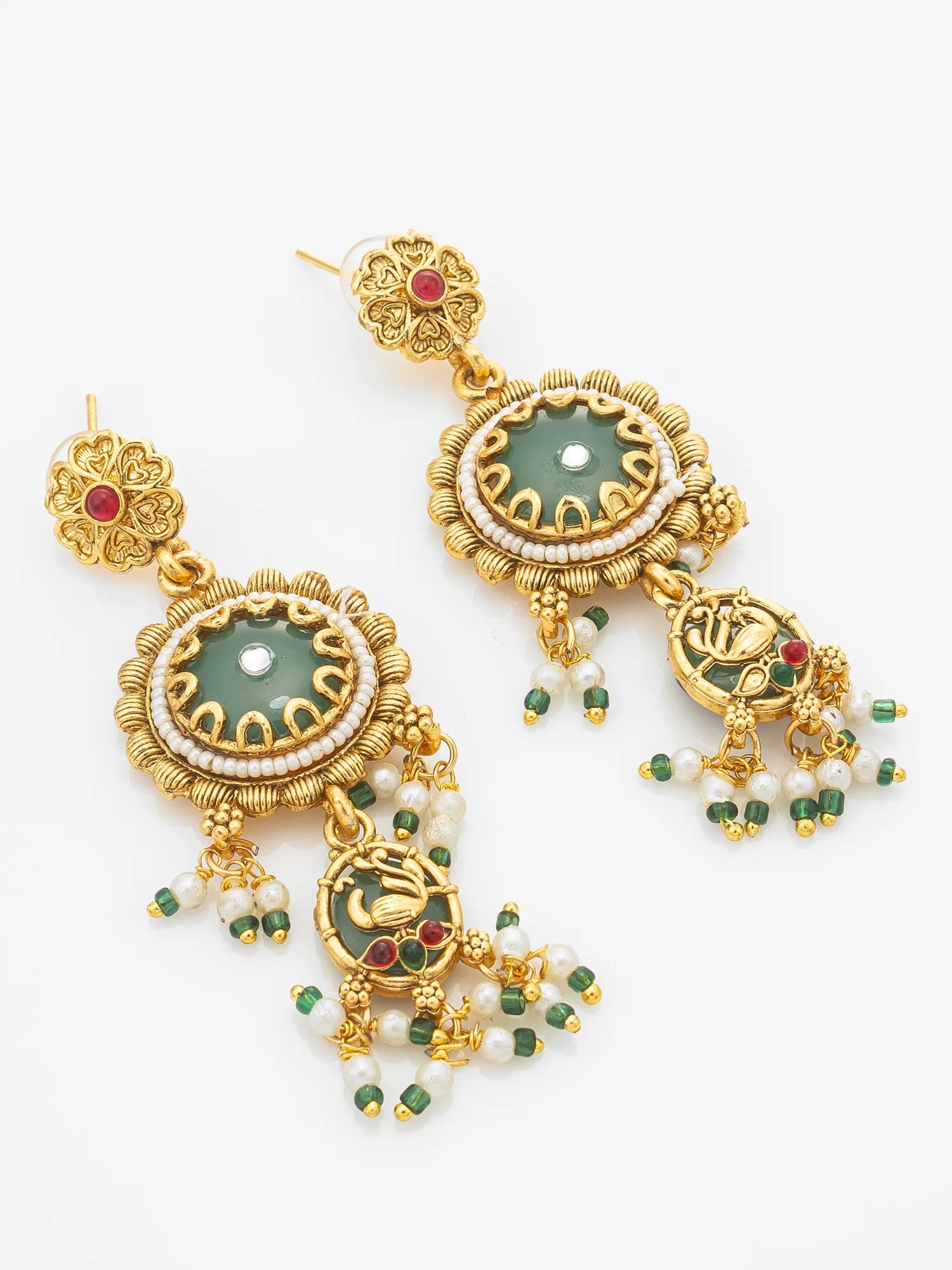 A pair of ornate gold-plated dangle earrings featuring green stone centers, white pearl-like beads, and small red and green accent stones, displayed on a clean white background.