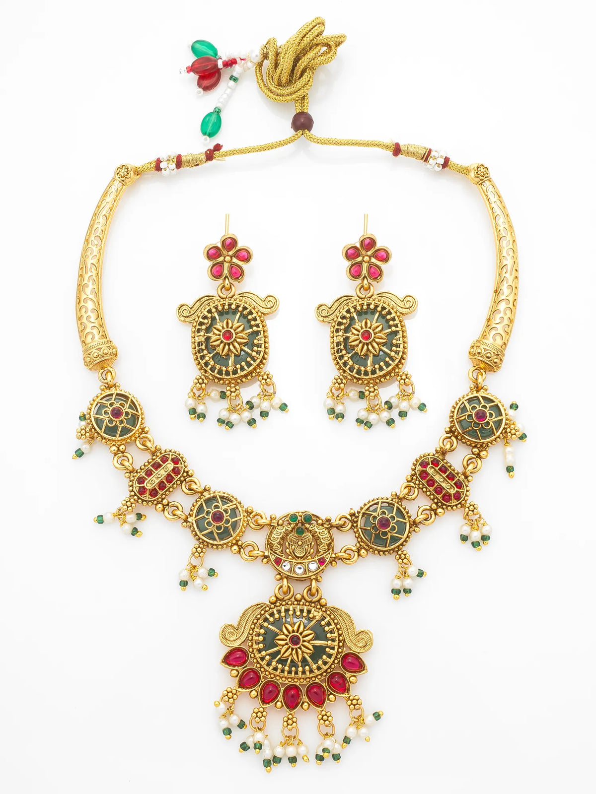 Gold-plated traditional Indian jewelry set featuring a necklace and matching earrings with red and green enamel details, displayed on a clean white background.
