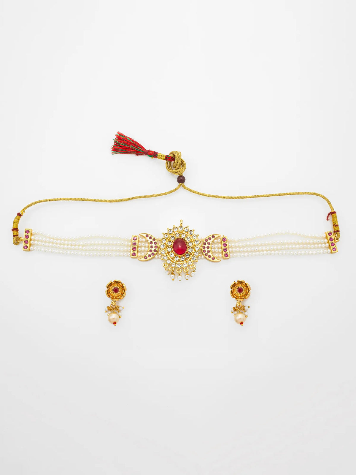 Gold-plated traditional Indian jewelry set featuring a choker necklace with a central red stone, pearl strands, a decorative tassel, and matching drop earrings on a white background.