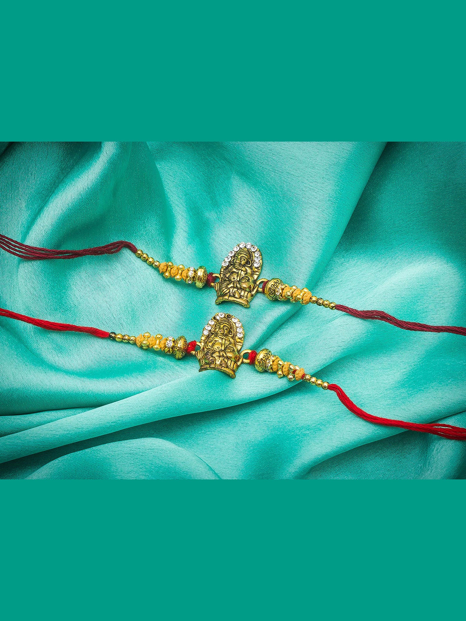 Aadita Ganesh Ji Twin Rakhi Set with Antique Gold Finish and Sparkling Stones