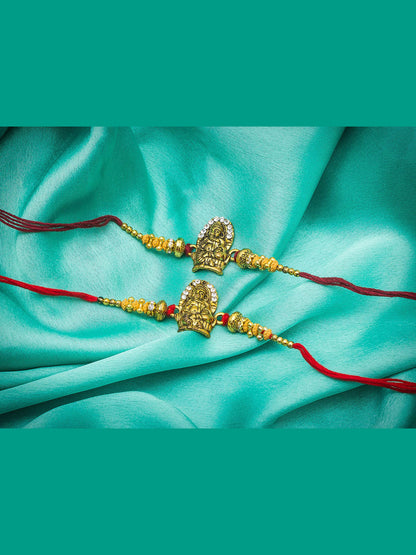 Aadita Ganesh Ji Twin Rakhi Set with Antique Gold Finish and Sparkling Stones