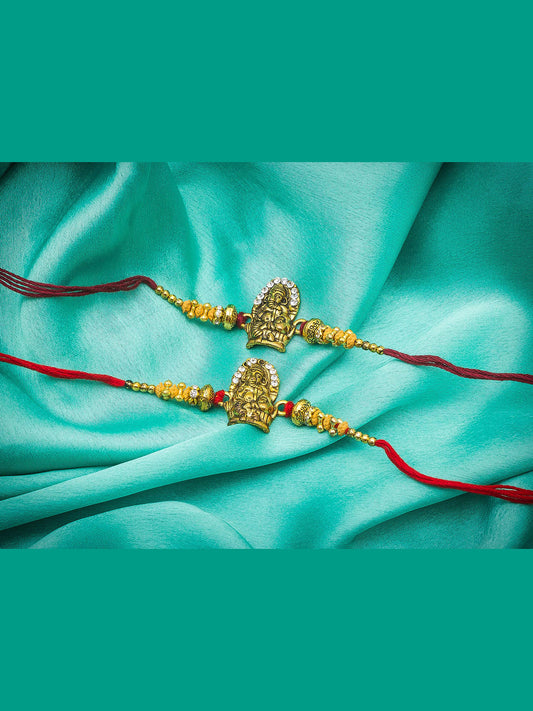 Aadita Ganesh Ji Twin Rakhi Set with Antique Gold Finish and Sparkling Stones